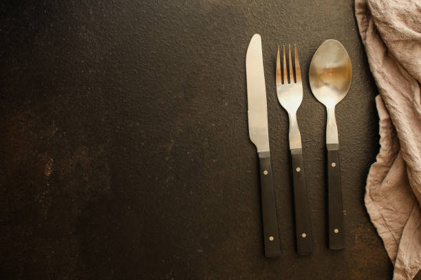 istock cutlery rustic, used for eating or serving (fork, knife, spoon, plate - set). food background. copy space 1166682900