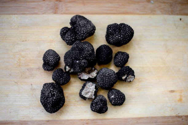 istock Black truffles on a wooden board 1166683968