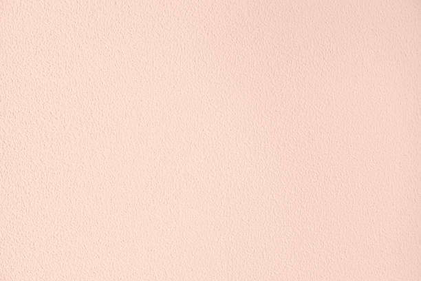 Pale pink colored low contrast Concrete textured background