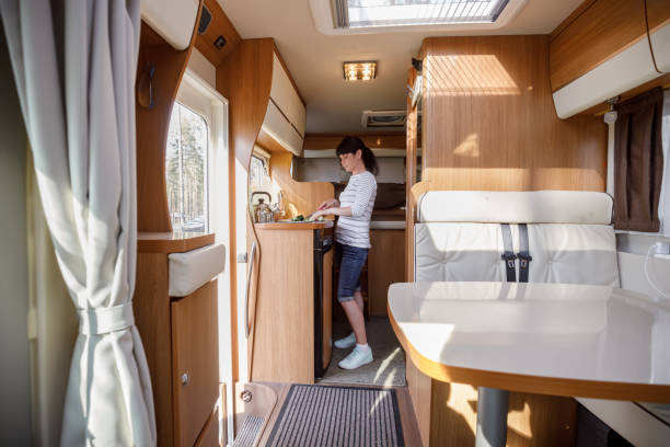 istock Woman cooking in camper, motorhome interior 1166685972