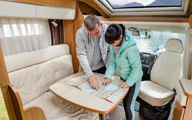 istock Couples in RV Camper looking at the local map for the trip. 1166685985