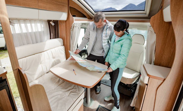 istock Couples in RV Camper looking at the local map for the trip. 1166686092