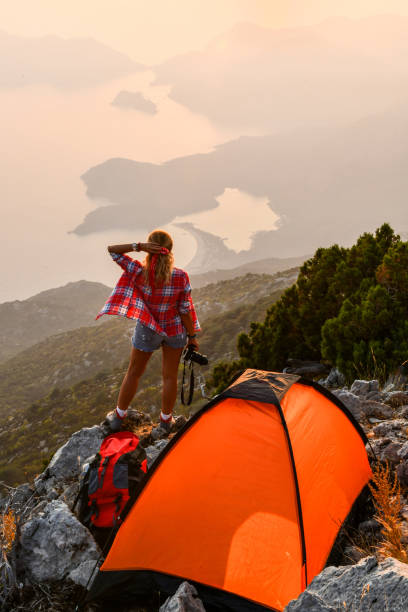 istock Female photographer camping. 1166692700