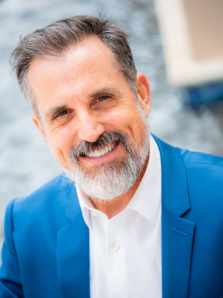 istock Attractive caucasian man smiling cheerfully at camera 1166694450