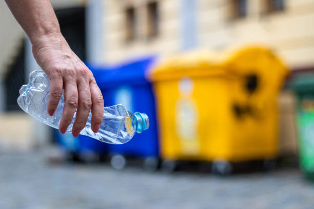 istock Recycling plastic waste. Hand holding plastic bottle. 1166696293