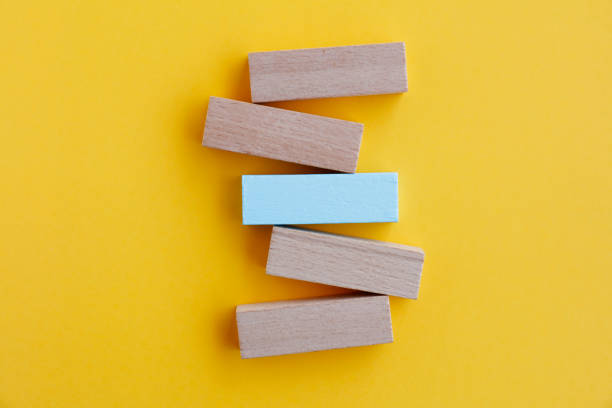 istock Wooden blocks on color background 1166696971