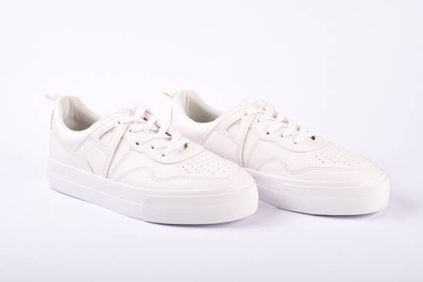 istock A pair of white sneakers on the white background 1166703113