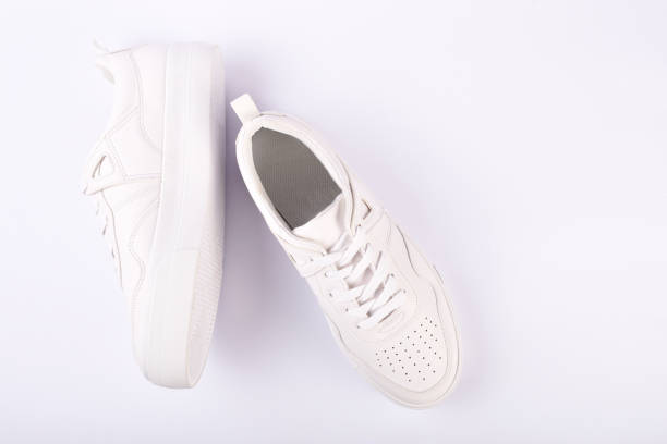 istock A pair of white sneakers on the white background 1166703144