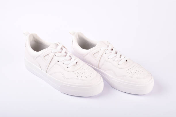 istock A pair of white sneakers on the white background 1166703196