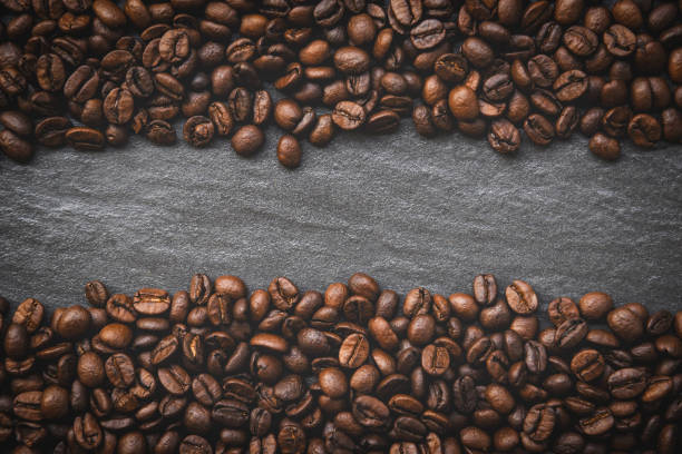 istock Coffee beans on dark background top view with place text copy space 1166709718