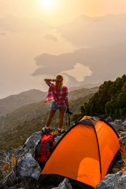 istock Female photographer camping. 1166710627
