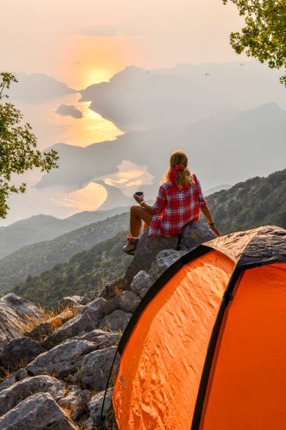 istock Woman in tent camp. 1166712489