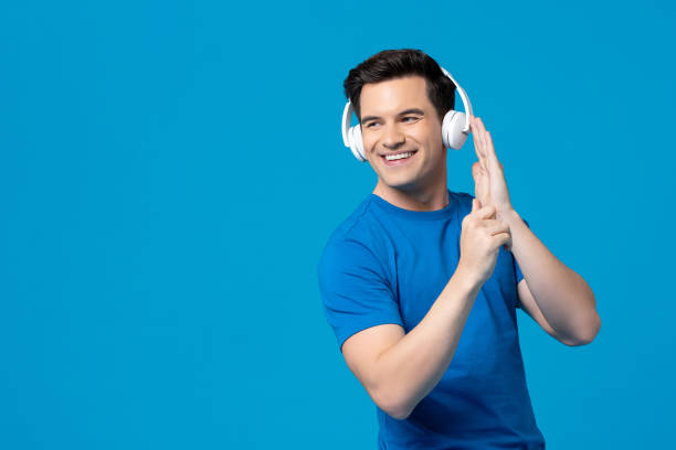 istock Smiling American man listening to music 1166716511