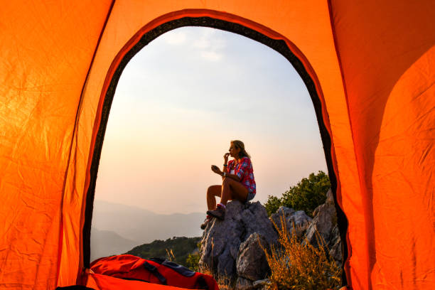 istock Woman in tent camp. 1166720718