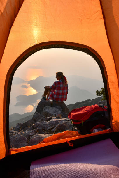 istock Woman in tent camp. 1166723964