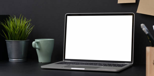istock Stylish workplace with open blank screen laptop 1166728690