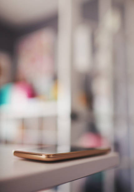istock Smart phone on desk in modern home office 1166729050