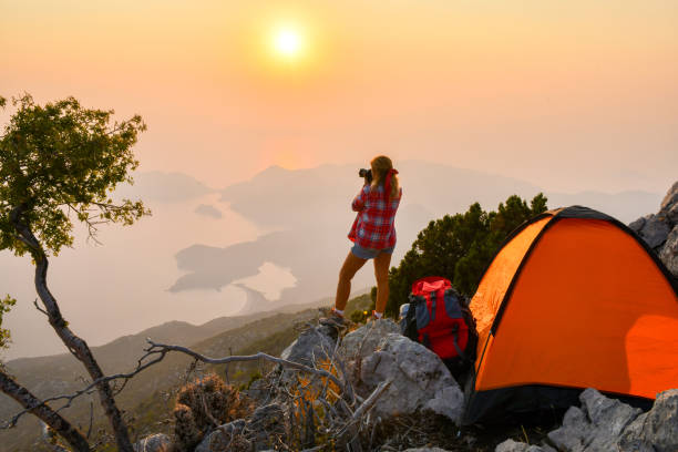 istock Female photographer camping. 1166730636