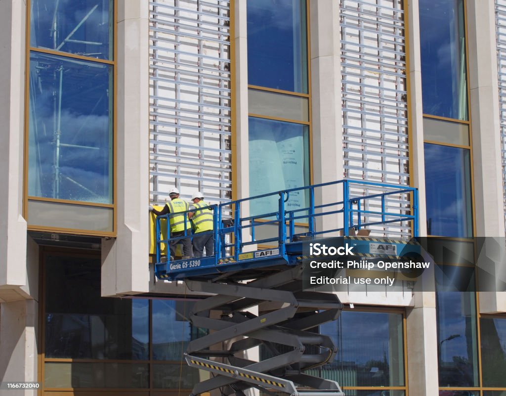 Construction Build Platform Two Men In Protective Clothing Working On An Elevated Construction ...
