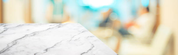 istock marble table top product display background with blur patient in hospital.left perspective stone kitchen counter with people waiting doctor in hallway.Banner mockup presentation for  health product 1166737021