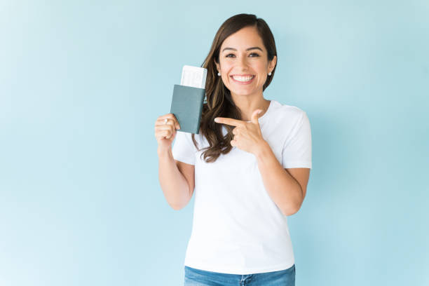 istock Happy Female With Passport Ready To Explore 1166739442