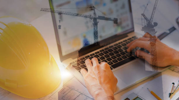 istock Double exposure of engineer use her laptop for architectural project and working with partner engineering. 1166740624