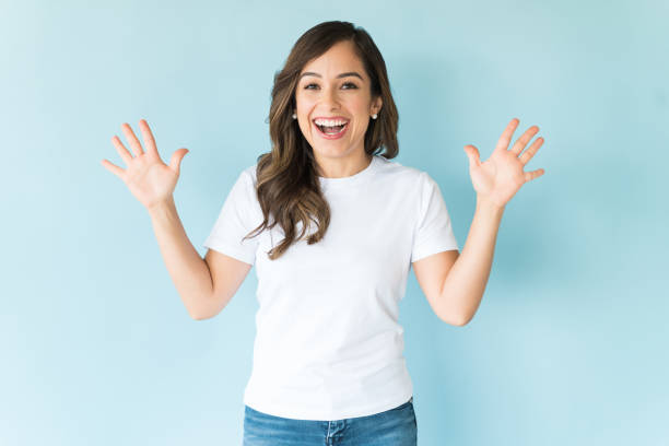 istock Amazed Happy Female Over Blue Background 1166740713