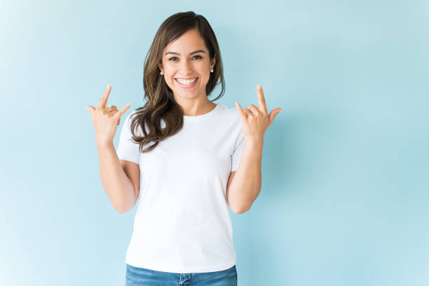istock Cheerful Female Gesturing Hand Sign In Studio 1166741788