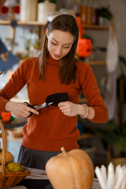 istock Young woman preparing for Halloween 1166742917