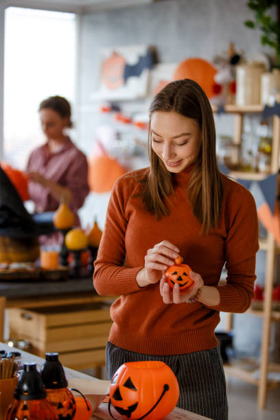 istock Young woman making decorations for Halloween 1166742974
