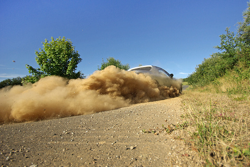 racing sport car sliding  in dust