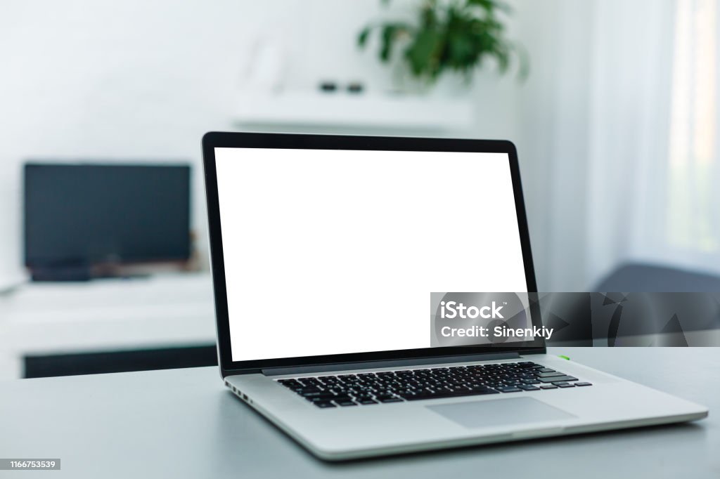 Brand new notebook with with display on table. notebook computers Raincoat Stock Photo