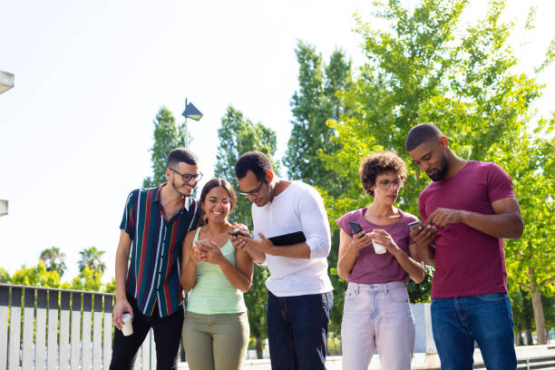 istock Happy people in casual using smartphones 1166754314