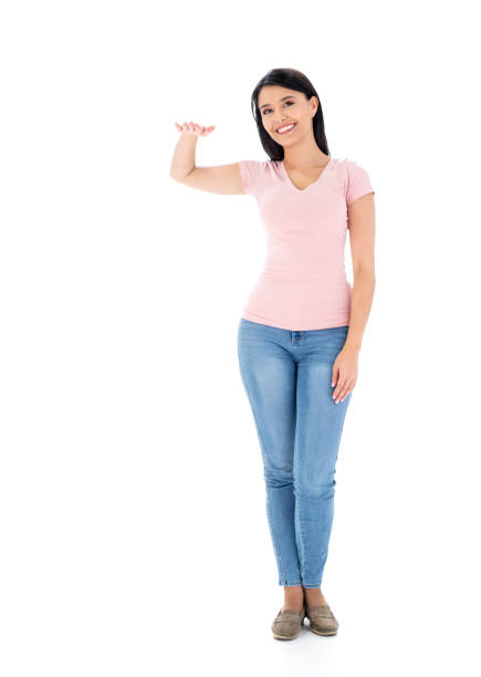 istock Happy woman with her hand on an imaginary object 1166756146
