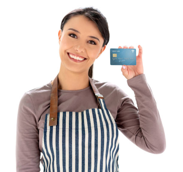 istock Latin American waitress holding a credit card 1166756519