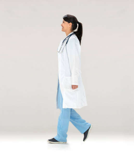 istock Happy Latin American doctor walking 1166757787
