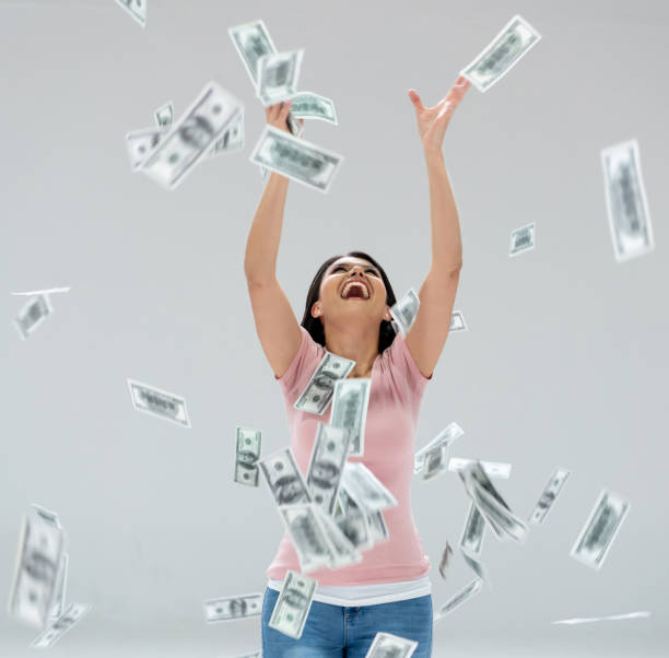 istock Excited woman winning the lottery 1166757795