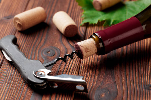 istock Corkscrew and bottle of wine on the board 1166759214