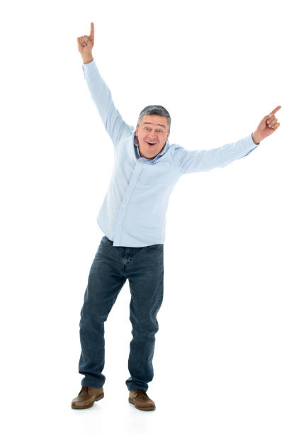 istock Excited man celebrating with arms up at the studio 1166759361