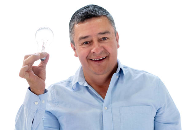 istock Creative adult man holding a lightbulb 1166759492