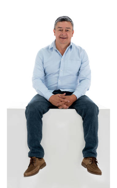istock Man sitting on a box and smiling 1166759561
