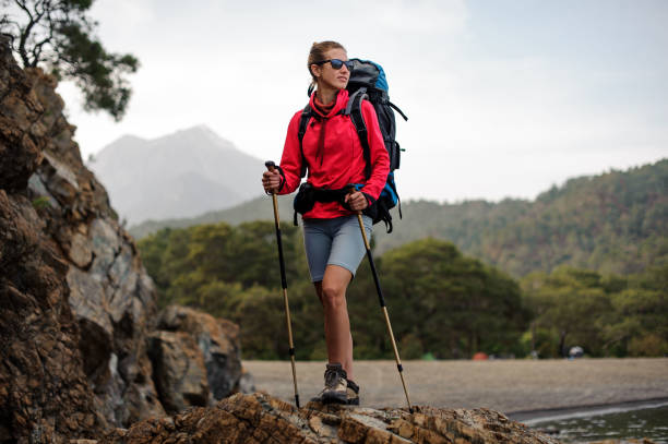 istock Female wanderer posing on top of the stone 1166759746
