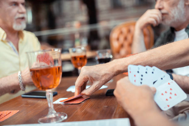 istock Close up of bearded men gambling and talking 1166760940