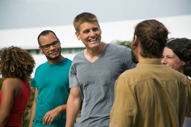istock Cheerful exited friends chatting outside 1166761130