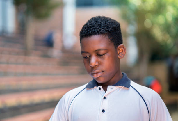 An African boy looking contemplatively into the distance.