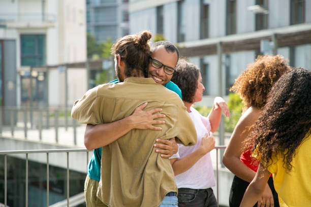 istock Cheerful male friends hugging each other 1166761350