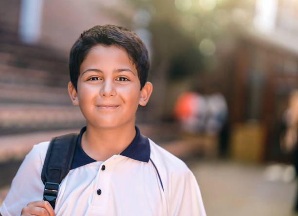 istock Portrait of smiling schoolboy with backpack 1166761471