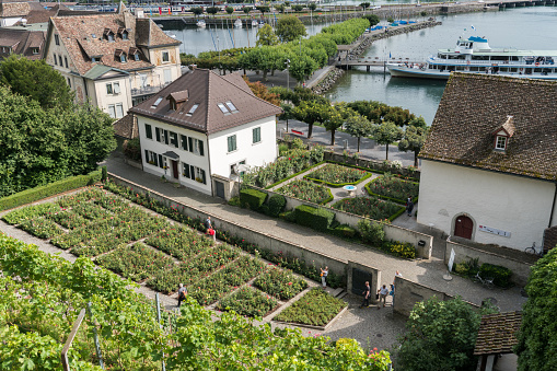Rapperswil, SG / Switzerland - 3. August 2019: high angle view of the historic old town and rose gardens of Rapperswil with Lake Zurich behind