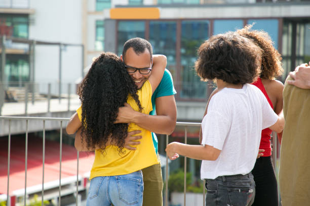 istock Happy Latin guy cuddling his black girlfriend 1166768147
