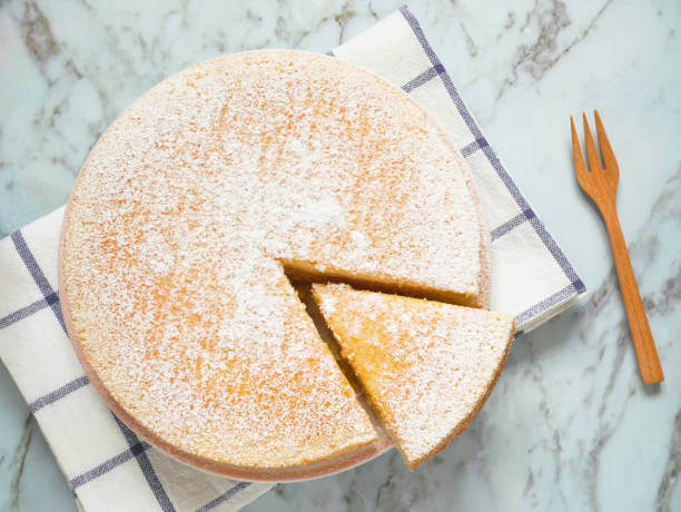 Homemade yogurt cake with icing sugar Homemade yogurt cake with icing sugar. Close up. Top view. powdered sugar stock pictures, royalty-free photos & images